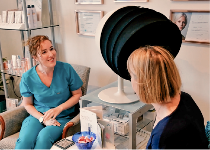 Laura providing personalised skin advice to a client