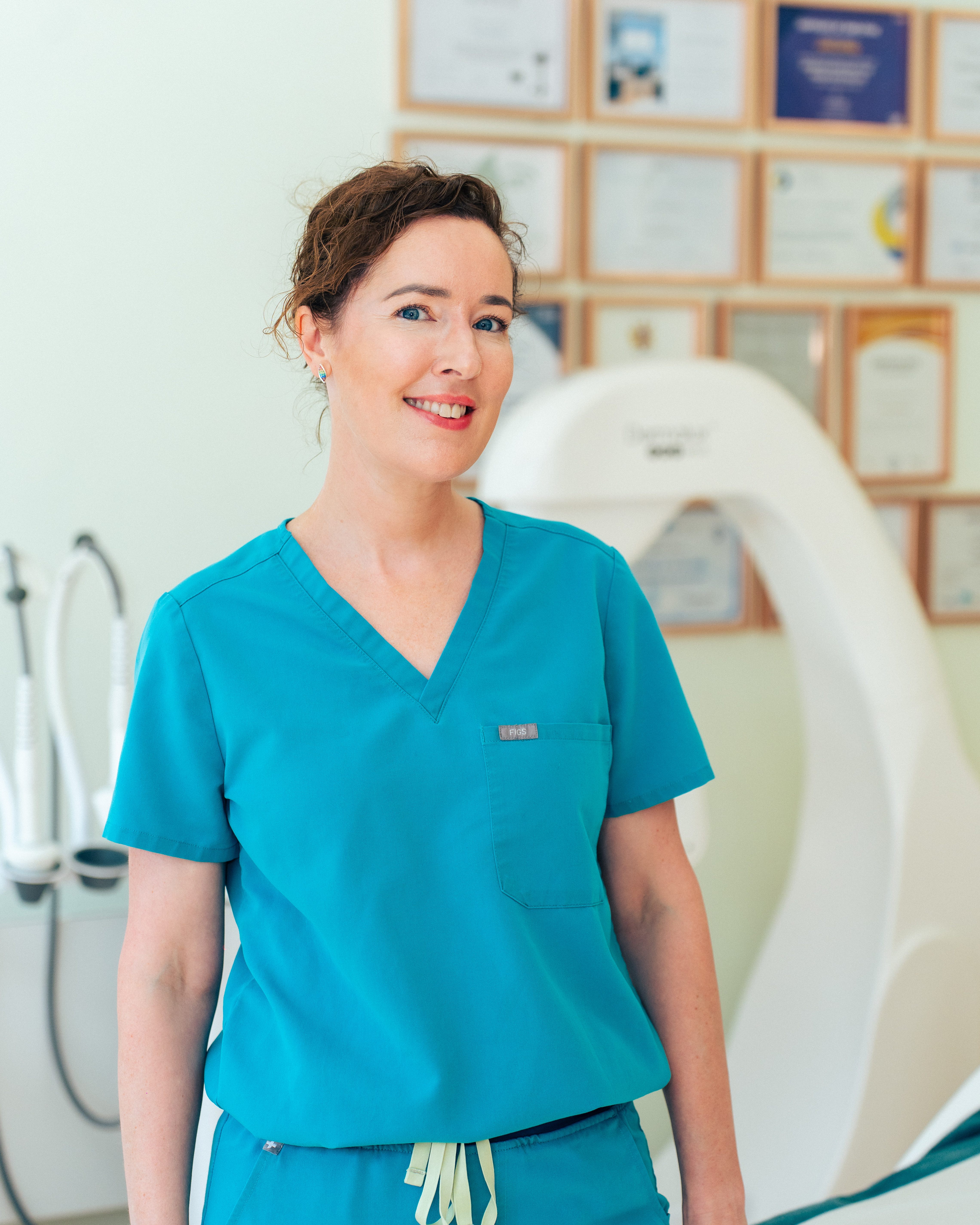 Laura providing professional medical aesthetic treatment to a client